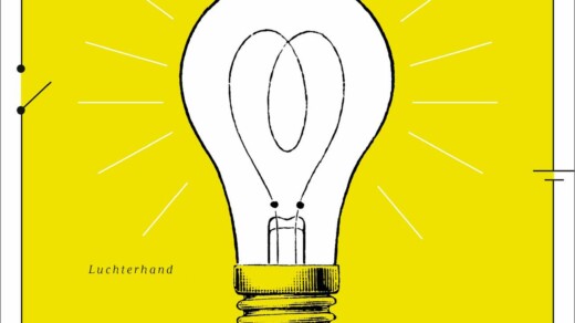 Glühbirne mit sichtbarem Glühfaden auf gelbem Hintergrund